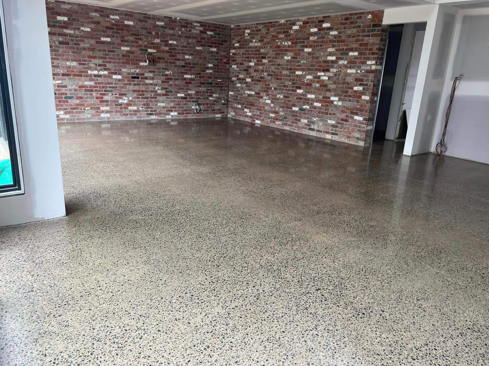 Polished concrete floor finished in an Echuca building, aggregate showing through an even sheen