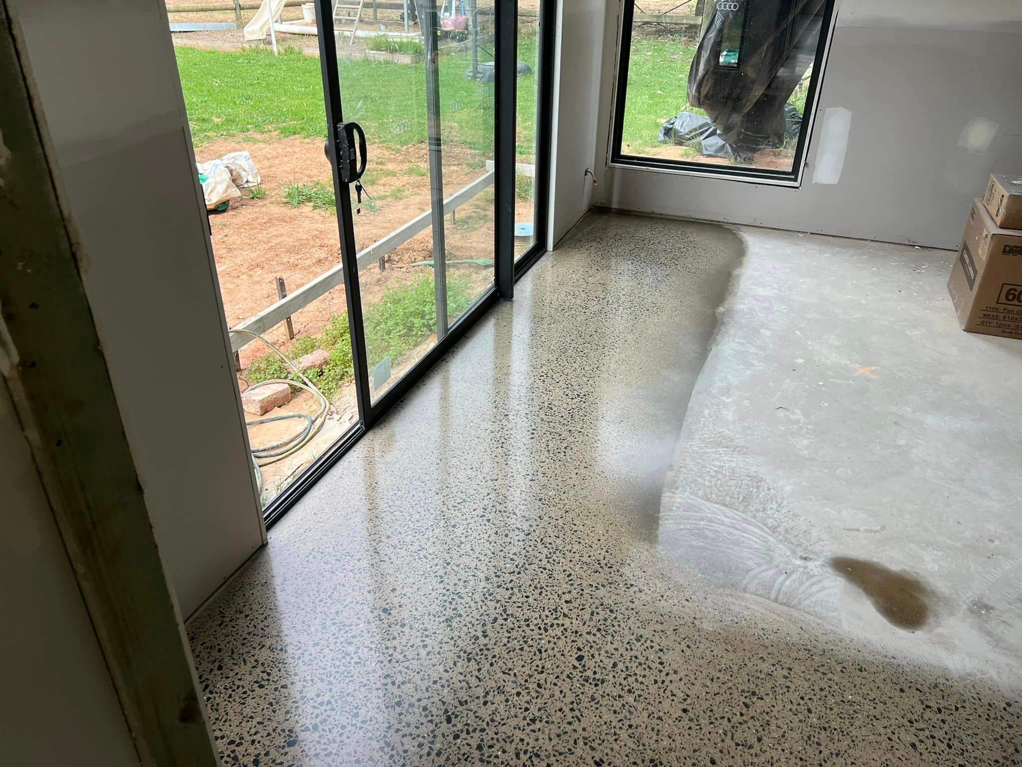 Finished polished concrete floor in Echuca showing an even aggregate exposure across a large room
