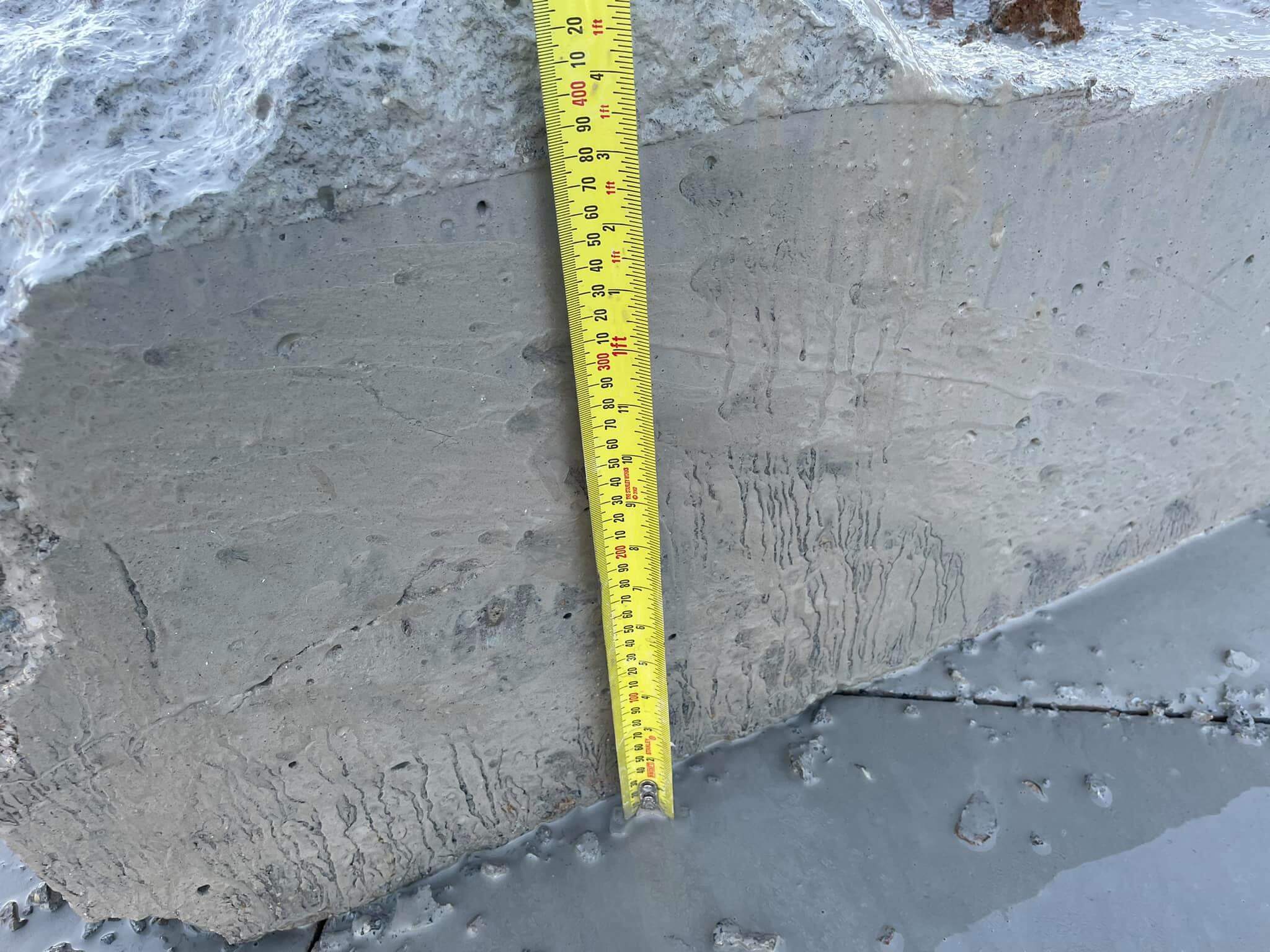 Saw cut lines running across a large concrete slab