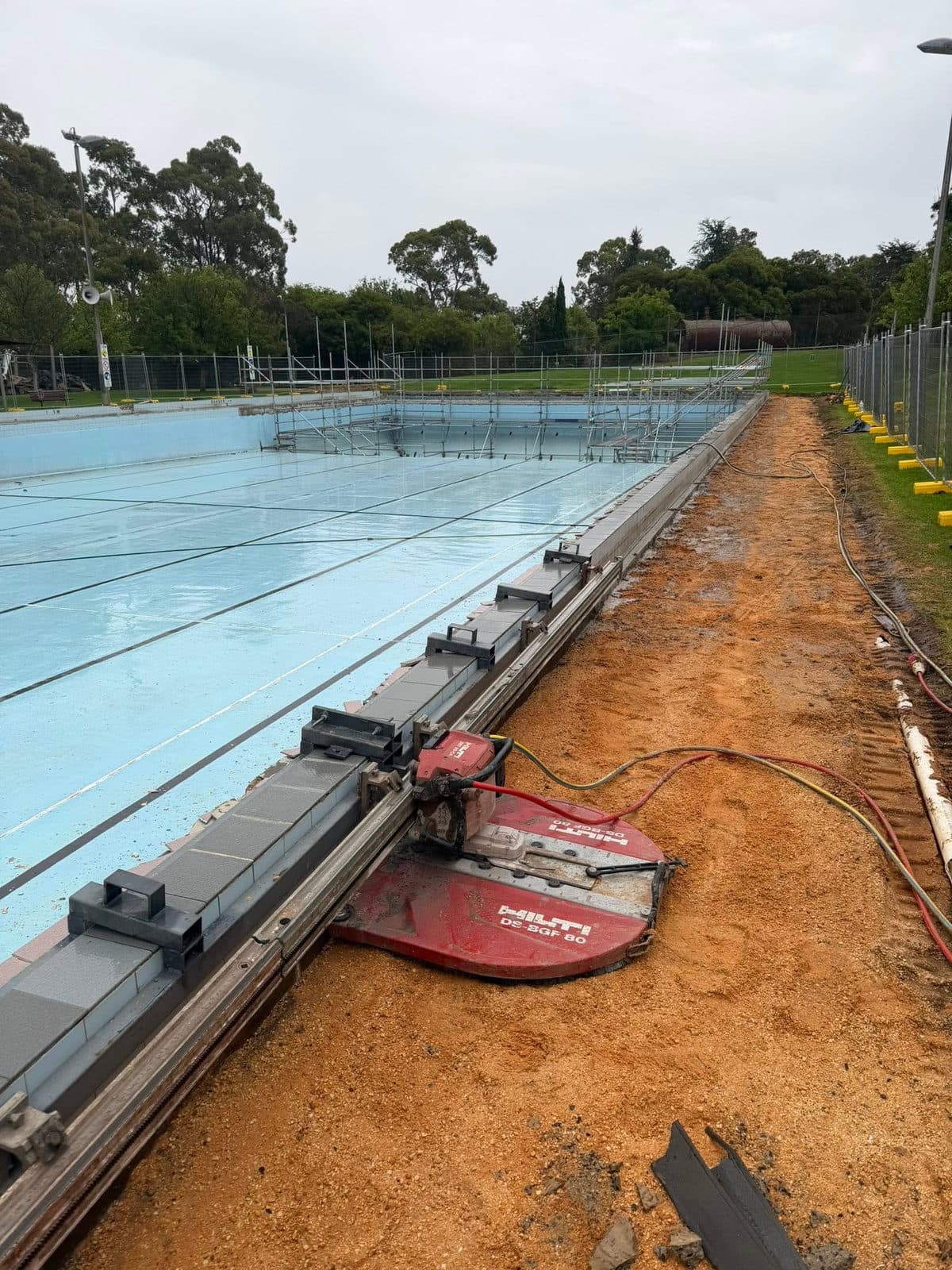 Wall saw running along the pool hob on a custom sliding frame at St Arnaud Pool