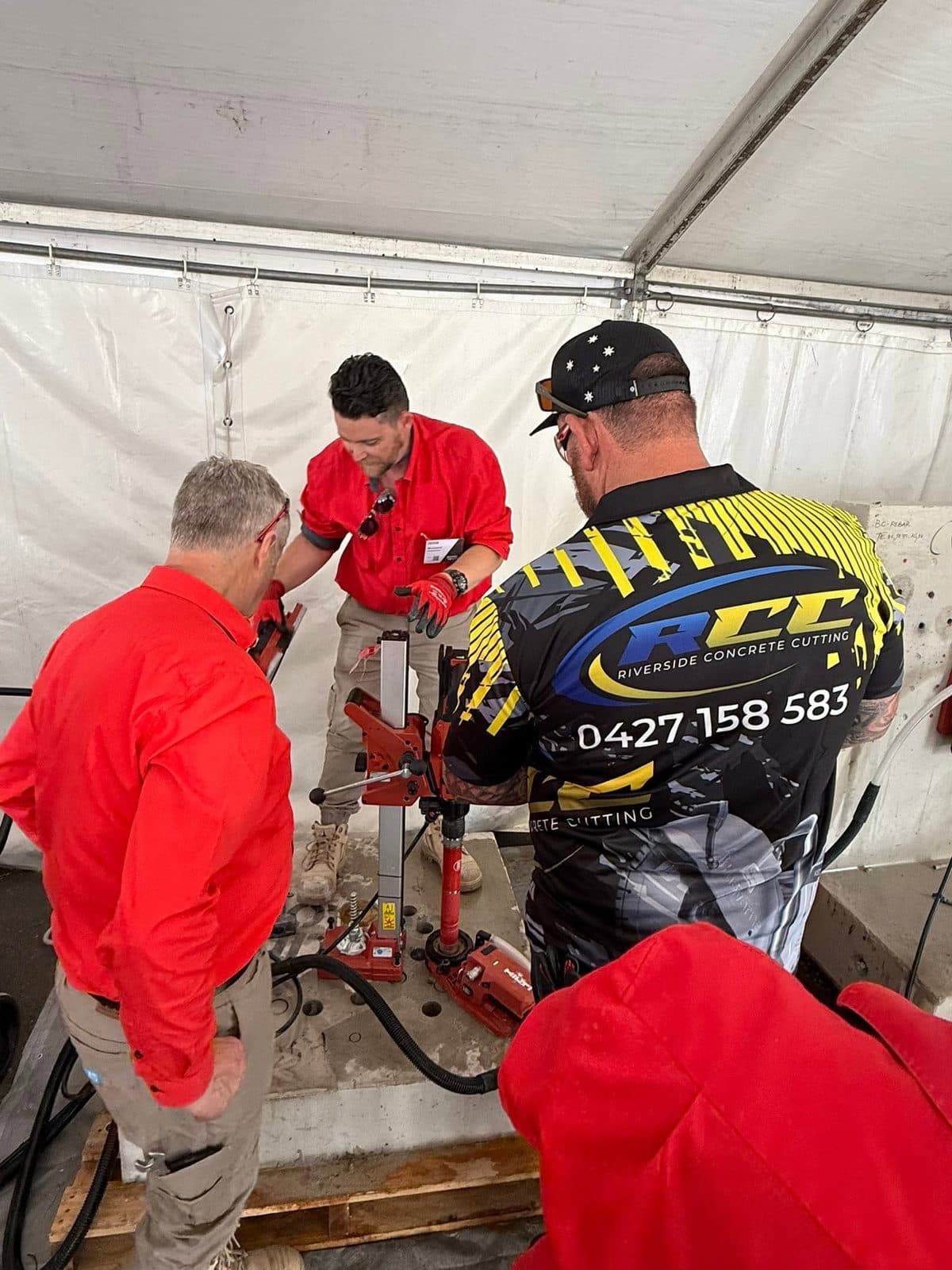 Riverside Concrete Cutting crew setting up a Hilti core drilling rig on site